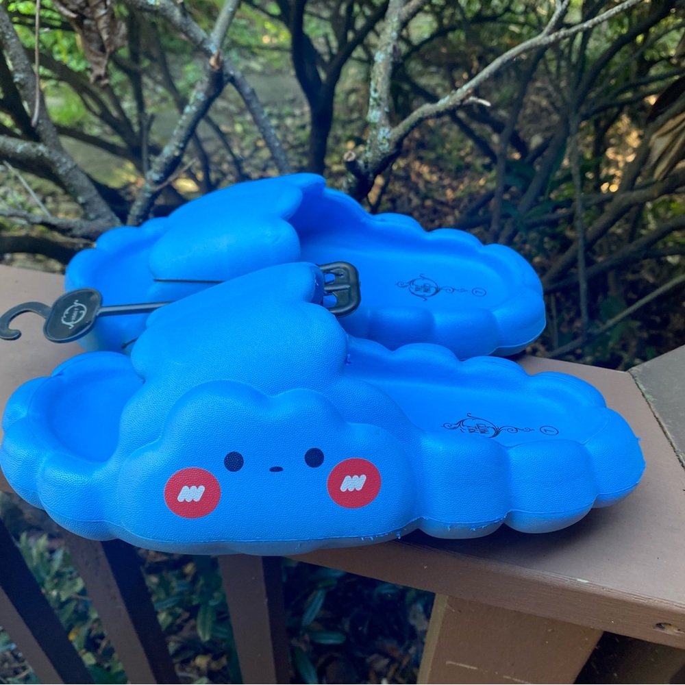 Playful Blue Cloud Sandals with Face Design